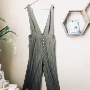 Olive green overall/jumpsuit.